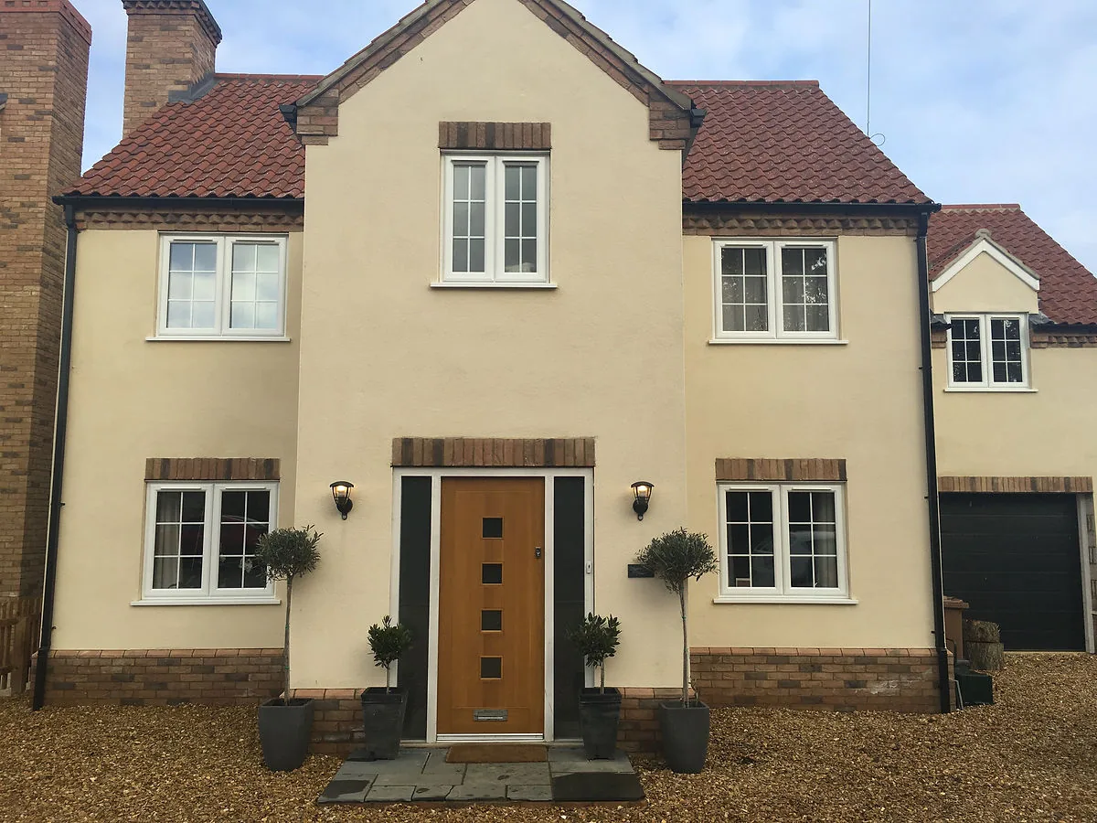 A rendered house exterior after professional softwashing